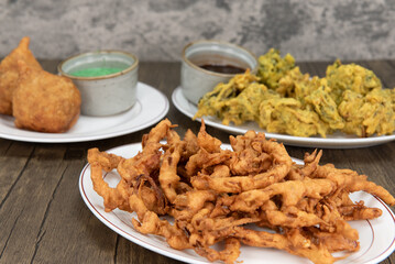 Table feast of some traditional Indian cuisine plates with the crispy onion bhaji featured up front