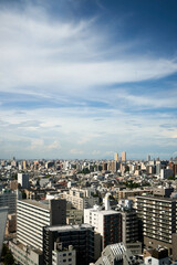 Tokyo Urban Skyline Against a Partly Cloudy Sky