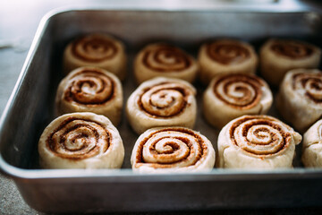 Aluminum pan of cinnamon rolls before baking