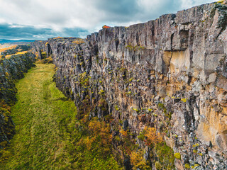 Steep rock wall, the ending of Atlantic tectonic plate in Thingvellir National Park