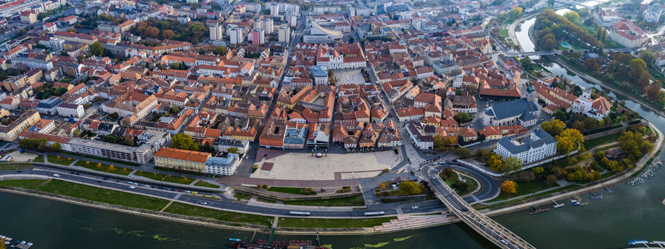 Aerial wide view around the city Győr in Hungary on a cloudy autumn day. © GDMpro S.R.O
