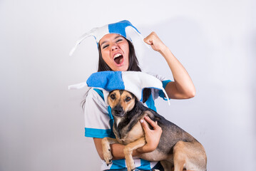 argentina fan, celebrating a goal with her dog, latin young girl, world cup, world cup