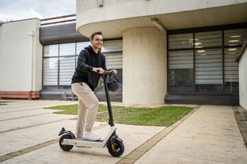 caucasian man drive or ride electric kick scooter e-scooter
