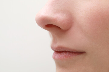 Woman with dry skin on white background, closeup of mouth