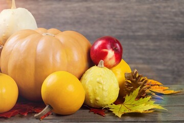 Fresh ripe autumn pumpkins on desk