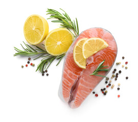 Fresh raw salmon steak with rosemary, peppercorns and lemon on white background, top view
