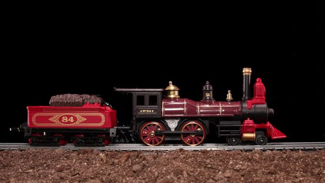 Steam Locomotive Engine model toy train travels down tracks with transparent alpha channel composite loop-able 
