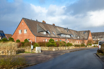 Fototapeta na wymiar scenic old historic brick houses in List, a small village at the island of Sylt, Germany