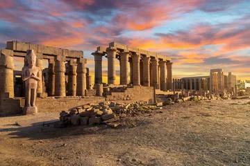 Foto op Plexiglas The ancient Karnak Temple along the River Nile under colorful evening skies in the city of Luxor Egypt. © Kirk Fisher