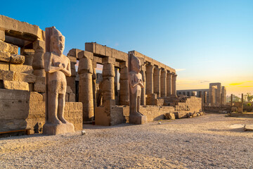 Early sunset view of the ancient Karnak Temple complex along the Nile River in the Egyptian city of...