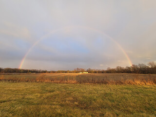 Fototapeta na wymiar rainbow over the fields