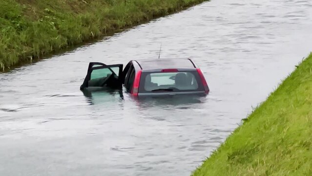 Sinking car in the river. Concept of auto car insurance