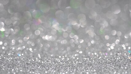 Black brilliant shiny sparkly texture. Light bokeh effect abstract Christmas background