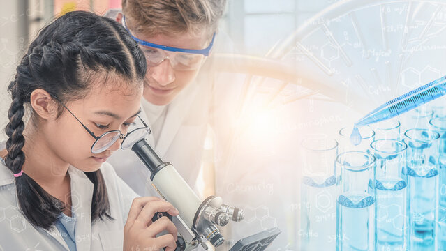school students using microscope in science laboratory class