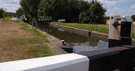 Wide shot off Aston Lock on the Trent and Mersey Canal with old narrow boat entering the lock