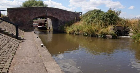Wide shot off Aston Lock on the Trent and Mersey Canal with narrow boats leaving the lower lock