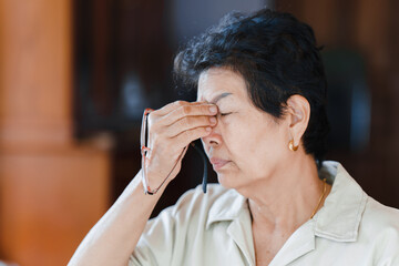Older women have eye problems such as macular degeneration. Concept of health problems in the...