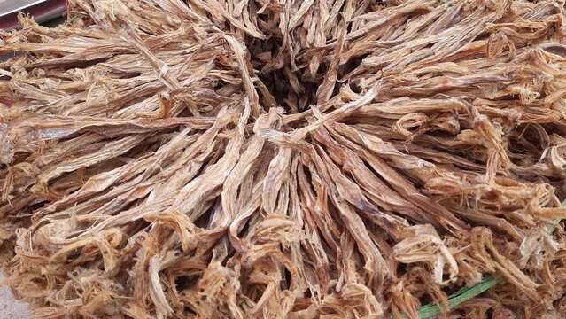Dried Bombay Duck Or Bombil Fresh Fish On Bamboo Baskets To Sale In Weekly Market 