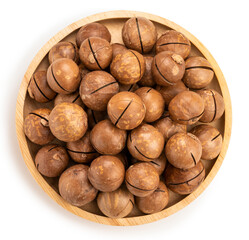 Roasted Macadamia nut in wooden plate on wooden background, Macadamia nuts on wooden background.