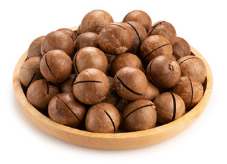 Roasted Macadamia nut in wooden plate on wooden background, Macadamia nuts on wooden background.