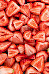 Fresh cut strawberries. Macro shot. Strawberries background. Top view.