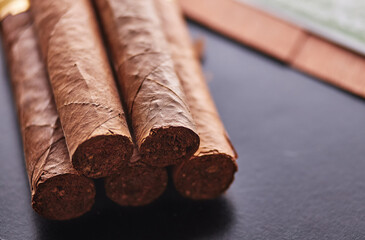Five Cuban cigars. Little depth of field.