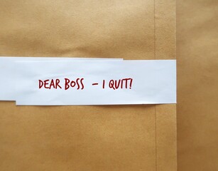 Office envelope pack with text written DEAR BOSS I QUIT, concept of decision making to quit job, leave employment, quit being full time workers, employees hates their jobs and decide to resign
