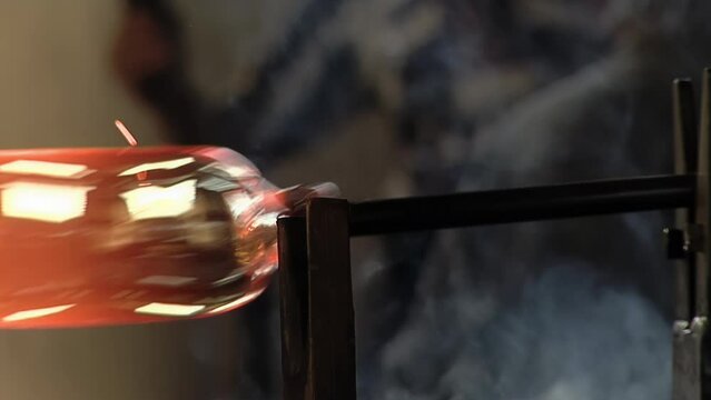 Glass Maker Craftsman Shaping Molten Glass into Fine Crystal Products, The Art of Hand-blown Glass. Close Up. 4K Resolution.