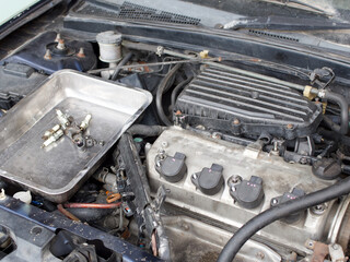 Repairing a benzine car engine, garage service concept 