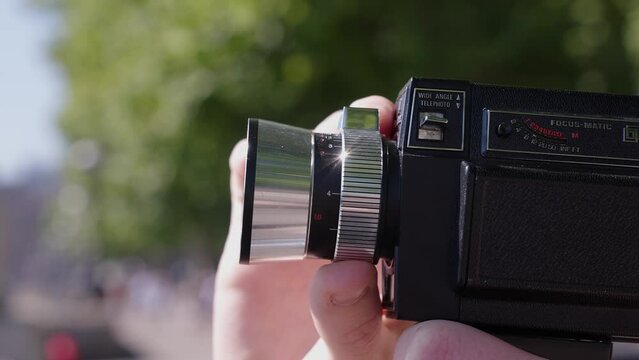Cinematic shot of traveller using camera in London