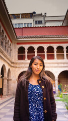 latin woman in blue tourist dress in a convent in La Paz Bolivia-Editar