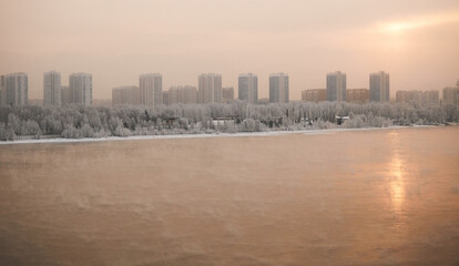 Fototapeta premium Winter sunset panoramic view of the Yenisei River and the city of Krasnoyarsk.