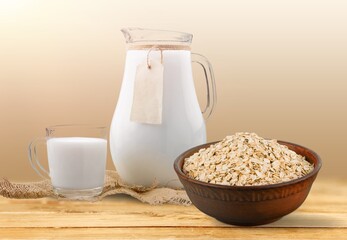 Fresh tasty oat milk dairy products on desk