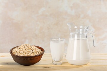Fresh tasty oat milk dairy products on desk