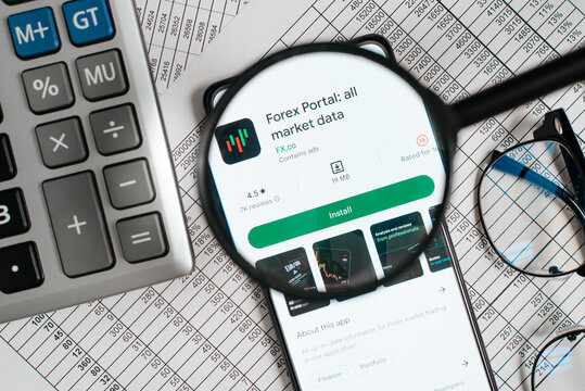 Forex portal for traders is financial mobile application in online store on smartphone at workplace, top view. View through magnifying glass, close-up. Astana, Kazakhstan 12.12.2022