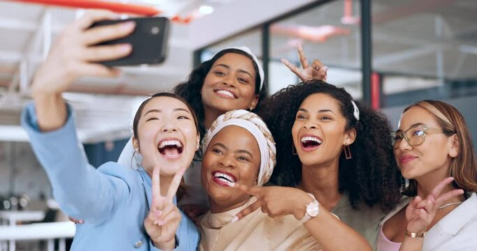 Business people, peace sign and phone selfie in office for happy memory, profile picture or social media. Tech, cellphone and group of women, friends or coworkers taking pictures on mobile smartphone