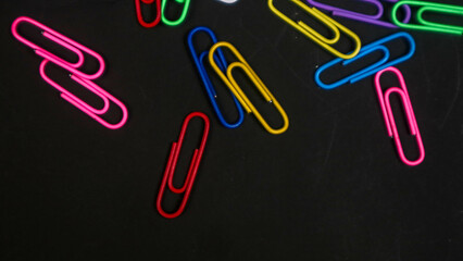 Paper clip isolated on a black background