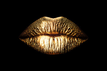 Golden lips isolated on black background. Luxury glamour art mouth. Clipping path gild lips. - obrazy, fototapety, plakaty