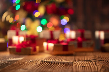 Naklejka na ściany i meble Christmas background. Shallow depth of focus. Colorful bokeh lights, rustic wooden table. Place for typography. 