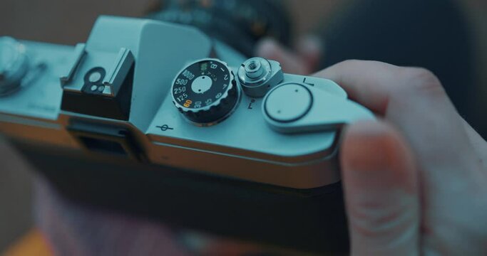 Hand reloading an old film camera in slow motion 4K