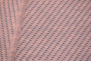 New shingles on the roof of the house