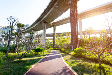 Red sidewalk under the overpass