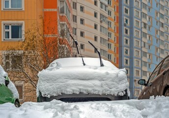 Car in the snow with the wipers raised