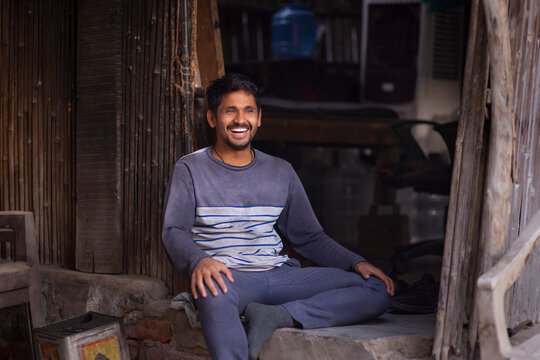 Rickshaw puller resting  in his hut