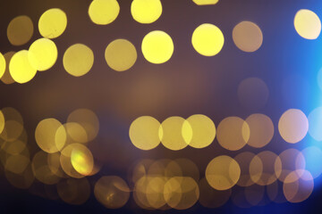 Abstract bokeh background. Golden bokeh circles on dark blue background. Layer overlay.