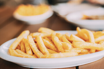 french fries on plate. street food, snacks,