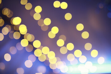 Abstract bokeh background. Golden bokeh circles on dark blue background. Layer overlay.