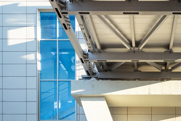 Metal frame of bridge on a concrete support.