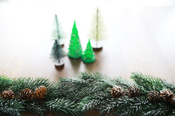 Fototapeta na wymiar Christmas background with fir tree and decoration on dark wooden board