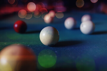 Billiard balls and cue on pool table. Russian billiards. Close-up of items for the game. Background space. Concept of sports games. Place for an inscription or logo. Copy space for site or banner